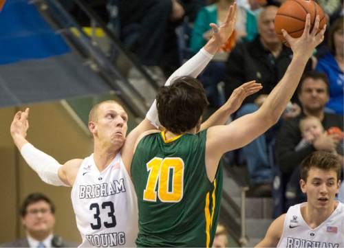 Rick Egan  |  The Salt Lake Tribune

San Francisco Dons forward Matthew McCarthy (10) goes up for a shot, Brigham Young Cougars forward Nate Austin (33) defends  in basketball action BYU vs. San Francisco, at the Marriott Center, Saturday, January 9, 2015.