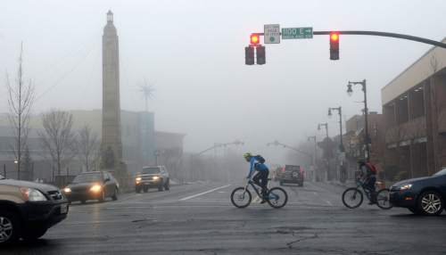 Al Hartmann  |  The Salt Lake Tribune
Commuters move through the dense fog with slippery roads Thursday morning  Jan 7 in Sugarhouse.