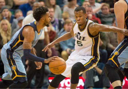 Rick Egan  |  The Salt Lake Tribune

Utah Jazz guard Rodney Hood (5) guards Memphis Grizzlies guard Mike Conley (11), as the Jazz win 92-87, in overtime, in NBA action Utah Jazz vs. The Memphis Grizzlies in Salt Lake City, Saturday, January 2, 2016. Hood finished with 32 points.