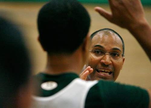 Steve Griffin  |  The Salt Lake Tribune
 
Kearns HIgh School boy's basketball coach Danny Cosby talks to his players during practice at the high school in Kearns Monday, November 29, 2010.