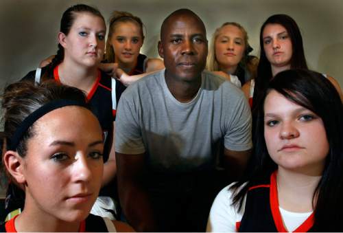Steve Grifffin  |  The Salt Lake Tribune

Evric Gray with members of the Murray High School girl's basketball team at the school in Murray. Thursday Nov 5, 2009.