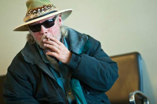 Chris Detrick  |   Tribune file photo
Mark Wood, of Idaho Falls, smokes in the smoking lounge before his flight to Houston at the Salt Lake City International Airport Tuesday November 20, 2012.