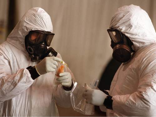 Tribune file photo
Jerry Roberts and Sgt. Teddy Conner conduct a bio surface sampling test in 1997 at Dugway Proving Ground. The test was to check suspect areas to identify potential contamination.