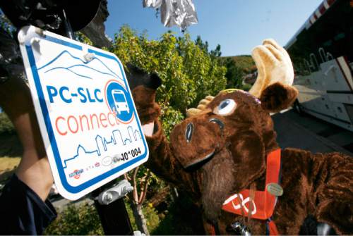 Francisco Kjolseth  |  Tribune file photo
Murdock the Moose peels the last of the plastic covering the new PC-SLC Connect sign in Park City in 2011. Ridership on the transit service has increased by 45 percent since it began operation.