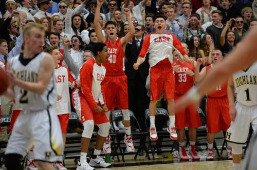 Steve Griffin  |  The Salt Lake Tribune


The East bench leaps into the air as the Lepeord's  Dacian Spotted Elk nailed a jump shot at the buzzer sending the  Region 5 rival game against Highland into double overtime at Highland High School in Salt Lake City, Tuesday, January 12, 2016. Highland defeated East in double overtime.
