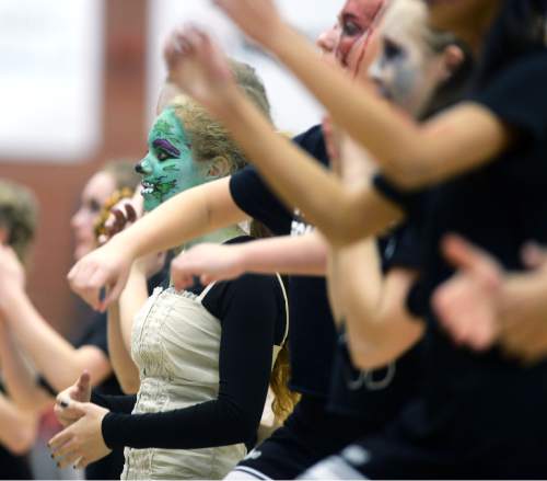 Steve Griffin  |  The Salt Lake Tribune


The Highland cheerleaders dressed in zombie makeup and costumes cheer on the Rams during Region 5 rival game against East at Highland High School in Salt Lake City, Tuesday, January 12, 2016. Highland defeated East in double overtime.