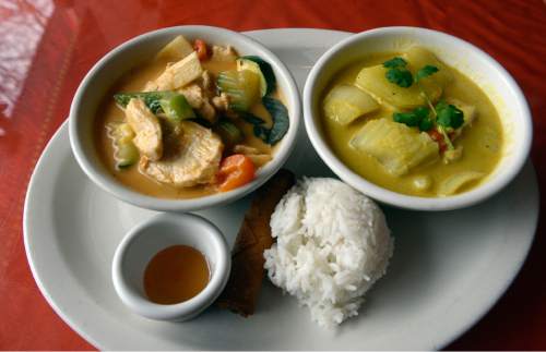 Al Hartmann  |  The Salt Lake Tribune
Red curry with chicken, left, and  yellow curry, spring roll and rice, one of many lunch combinations at Krua Thai, a family-owned restaurant in Salt Lake City at 212 E. 500 South.
