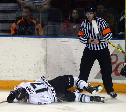 Steve Griffin  |  The Salt Lake Tribune


Grizzlies forward T.J. Syner falls to the ice after colliding with a referee during game against Tulsa at the Maverik Center in West Valley City, Wednesday, January 13, 2016.