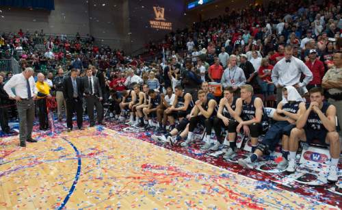 Rick Egan  |  The Salt Lake Tribune

Brigham Young Cougars head coach Mike Rose and his team sit amongst the confetti, as they await the announcement of the all tournament team, after being defeated by Gonzaga in the West Coast Conference championship game, at the Orleans Arena, in Las Vegas, Tuesday, March 10, 2015