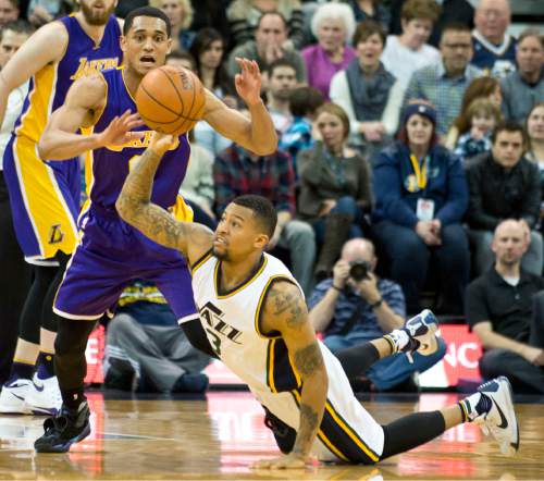 Lennie Mahler  |  The Salt Lake Tribune

Trey Burke tries to save the ball as he slips during a game between the Utah Jazz and the Los Angeles Lakers at Vivint Smart Home Arena in Salt Lake City, Saturday, Jan. 16, 2016.
