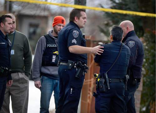 Scott Sommerdorf   |  The Salt Lake Tribune
Officer J Lopez gets some supportive attention from officers as they arrive at the scene of an officer-involved shooting, in Holladay, Sunday, January 17, 2016.