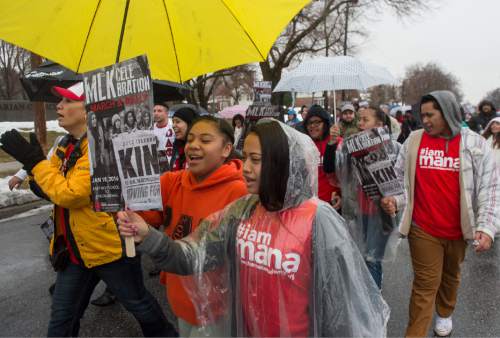Rick Egan  |  The Salt Lake Tribune

Participants walk in the rain along 1300 East, from East High School to University of Utah for the Martin Luther King Jr Day march, Monday, January 18, 2016.