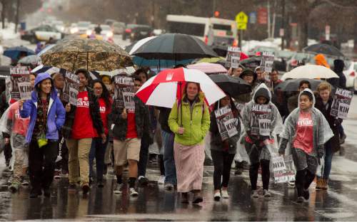 Rick Egan  |  The Salt Lake Tribune

Participants walk in the rain along 1300 East, from East High School to University of Utah for the Martin Luther King Jr Day march, Monday, January 18, 2016.