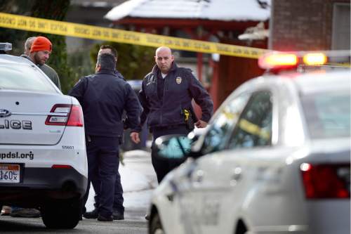 Scott Sommerdorf   |  The Salt Lake Tribune
Police at the scene of an officer-involved shooting, in Holladay, Sunday, January 17, 2016.