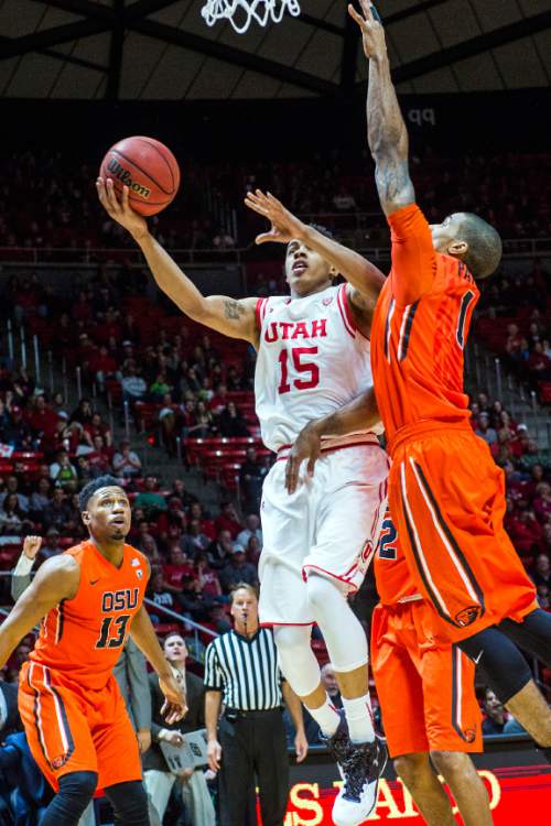 Chris Detrick  |  The Salt Lake Tribune
Utah Utes guard Lorenzo Bonam (15) shoots past Oregon State Beavers guard Gary Payton II (1) during the game at the Huntsman Center Sunday January 17, 2016.