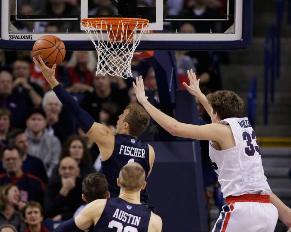 BYU's Chase Fischer (1) shoots against Gonzaga's Kyle Wiltjer (33) during the second half of an NCAA college basketball game, Thursday, Jan. 14, 2016, in Spokane, Wash. BYU won 69-68. (AP Photo/Young Kwak)