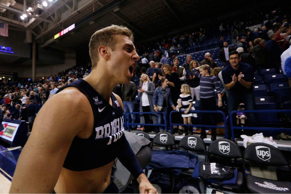 BYU's Chase Fischer celebrates after winning an NCAA college basketball game against Gonzaga, Thursday, Jan. 14, 2016, in Spokane, Wash. BYU won 69-68. (AP Photo/Young Kwak)