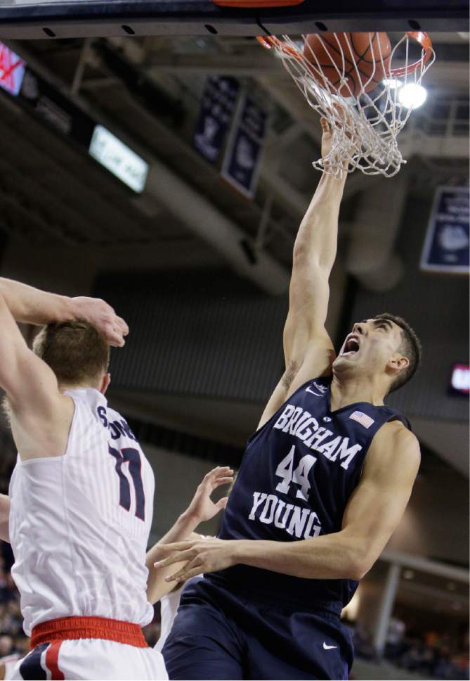 BYU's Corbin Kaufusi (44) shoots against Gonzaga's Domantas Sabonis (11) during the first half of an NCAA college basketball game, Thursday, Jan. 14, 2016, in Spokane, Wash. (AP Photo/Young Kwak)