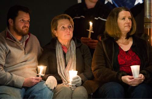 Rick Egan  |  The Salt Lake Tribune

Family members of Doug Barney, Brian Barney (brother) Darlene Barney (mother) and Erika Barney (wife), listen to speakers at a vigil for Doug Barney, at the  Holladay City Hall, Wednesday, January 20, 2016.