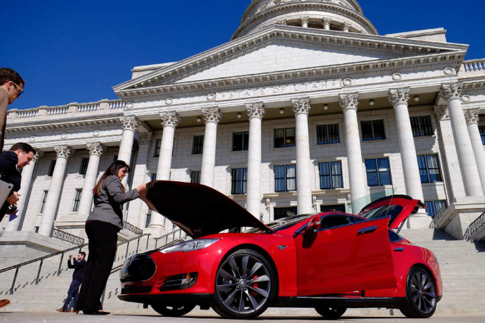Francisco Kjolseth  | Tribune file photo
Rep. Kim Coleman, R-West Jordan, left, tours a Tesla Model S in front of the Utah Capitol last March, the day after the House defeated her legislation HB394 to remove the current prohibition on manufacturers owning a dealership in the state. Currently they have to go through third-party franchises.