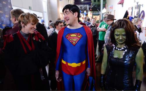 Francisco Kjolseth  |  The Salt Lake Tribune
Cosplayers Brooke Wilkins, Eric Hall and Mindy Madsen, from left, dress up for prizes as organizers of Salt Lake Comic Con announce Jan. 29-31 as the dates for the 2015 FanX celebration at a press event at the Megaplex 17 at Jordan Common in Sandy on Wednesday, Nov. 19, 2014.