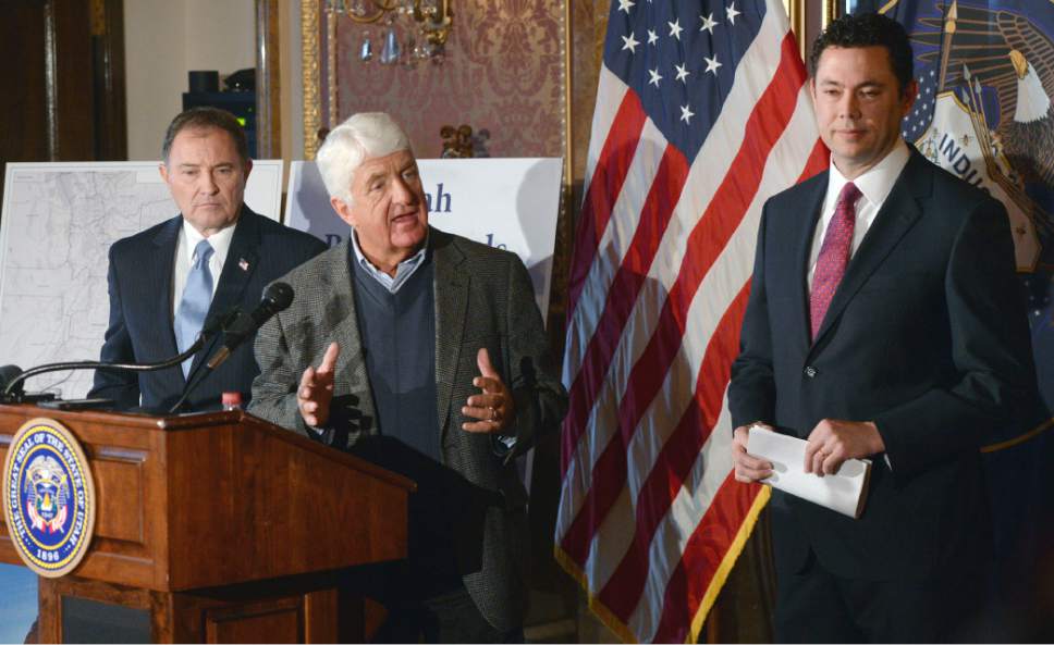 Al Hartmann  |  The Salt Lake Tribune
Utah Congressman Rob Bishop, center, with Utah Governor Gary Herbert, left, and Congressman  Jason Chaffetz, right, unveil a "discussion draft" of their Public Lands Initiative bill affecting 18 million acres in seven eastern Utah counties at the  Capitol Tuesday Jan. 20.  Bishop intends on introducing the bill in congress in the next few weeks.