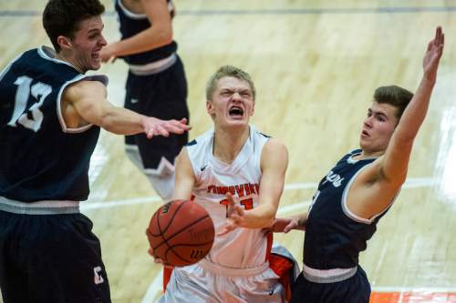 Chris Detrick  |  The Salt Lake Tribune
Timpview's Levi Wilson (11) drives to the basket past Corner Canyon's Brayden Johnson (13) and Corner Canyon's Braxton Coon (3) during the game at Timpview High School Friday January 22, 2016.