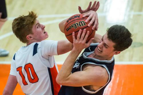Chris Detrick  |  The Salt Lake Tribune
Timpview's Hunter Erickson (10) and Corner Canyon's Brayden Johnson (13) go for the ball during the game at Timpview High School Friday January 22, 2016.