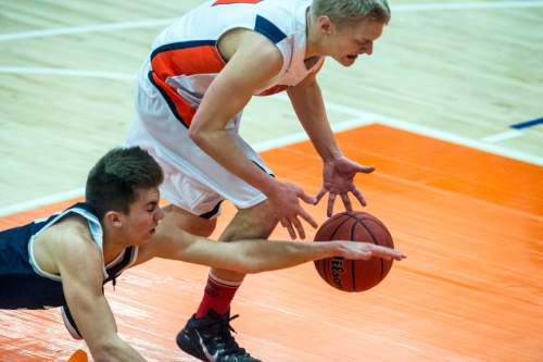 Chris Detrick  |  The Salt Lake Tribune
Corner Canyon's Braxton Coon (3) and Timpview's Levi Wilson (11) go for the ball during the game at Timpview High School Friday January 22, 2016.