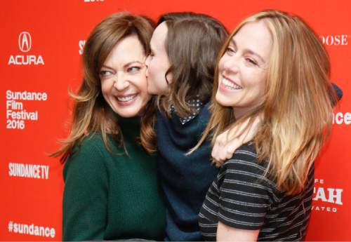 Actress Allison Janney, left, and director and writer Sian Heder, right, pick up actress Ellen Page, center, and Page gives Janney a kiss as they pose at the premiere of "Tallulah" during the 2016 Sundance Film Festival on Saturday, Jan. 23, 2016, in Park City, Utah. (Photo by Danny Moloshok/Invision/AP)