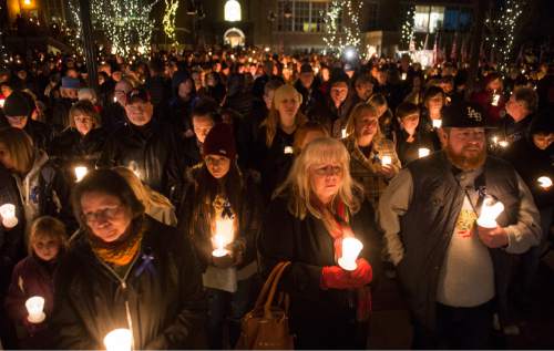Rick Egan  |  The Salt Lake Tribune

Supporters hold candles during a vigil for Doug Barney, hosted by Holladay City and the Unified Police Department officers of the Holladay Precinct and sponsored by the Salt Lake Valley Law Enforcement Association, at the  Holladay City Hall, Wednesday, January 20, 2016.