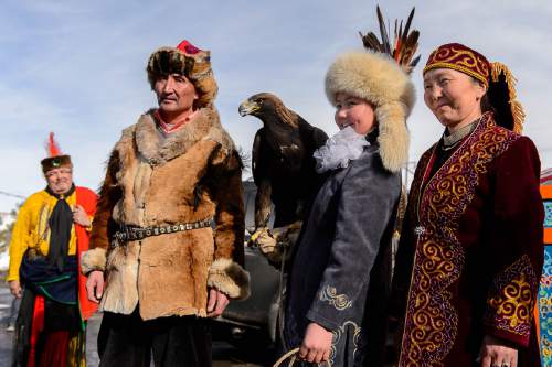 Trent Nelson  |  The Salt Lake Tribune
Aisholpan Nurgaiv, a 15-year-old Mongolian girl who is the first female in 2,000 years to learn to be a eagle hunter,stands with her parents Agalai, left, and Almagul, after a Comanche blessing by Waha Thuweeka, back, left, at the Kimball Art Center in Park City on Friday. Nurgaiv is the subject of the Sundance documentary, "The Eagle Huntress."
