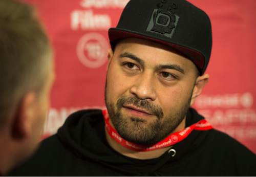 Steve Griffin  |  The Salt Lake Tribune

Tony Vainuku, director of  "In Football We Trust" talks with the media as he attends the Sundance premiere of  his documentary at the Salt Lake Community College's The Grand Theatre , in Salt Lake City, Friday, January 23, 2015. The documentary follows four teen boys, Harvey Langi, Leva Bloomfield, Vita Bloomfield and Fihi Kaufusi, from Utah's Pacific Islander community as they navigate the world of high-school football. The boys deal with such issues as extreme poverty, gang influence and family pressures to succeed on the field.