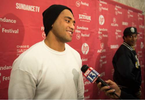 Steve Griffin  |  The Salt Lake Tribune

Harvey Langi, who played football for Bingham High School in South Jordan, talks to the media as he attends the Sundance premiere of ìIn Football We Trustî  at the Salt Lake Community Collegeís The Grand Theatre, in Salt Lake City, Friday, January 23, 2015. The documentary follows four teen boys, Langi, Leva Bloomfield, Vita Bloomfield and Fihi Kaufusi, from Utahís Pacific Islander community as they navigate the world of high-school football. The boys deal with such issues as extreme poverty, gang influence and family pressures to succeed on the field.