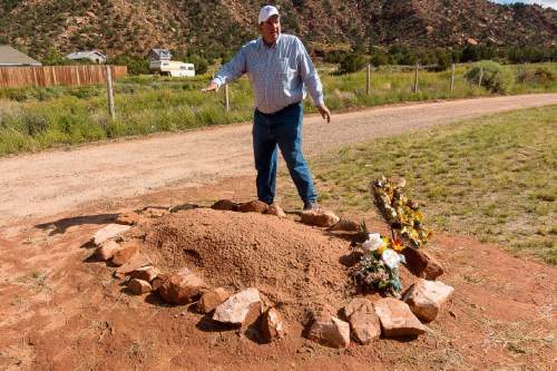 Trent Nelson  |  The Salt Lake Tribune

Dowayne Barlow stands over Walter Steed's grave at the Isaac W Carling Memorial Park Cemetery in Colorado City, Arizona, Wednesday September 16, 2015.