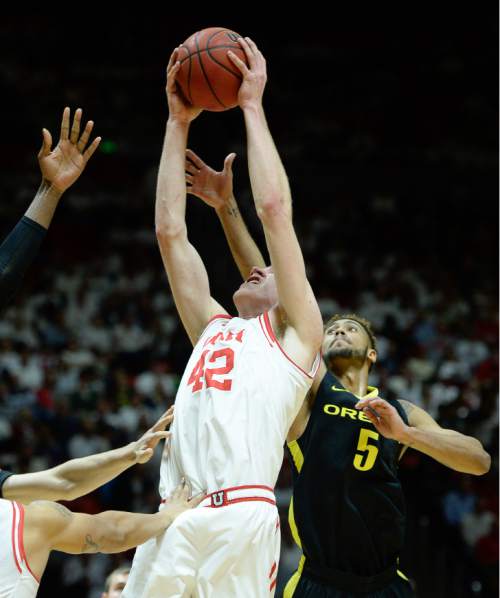 Francisco Kjolseth | The Salt Lake Tribune
Utah Utes forward Jakob Poeltl (42) lays one up agains Oregon in game action at the Huntsman Center on Thursday night.