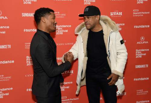 Nate Parker, left, the director, star and producer of "The Birth of a Nation," greets singer Maxwell at the premiere of the film at the 2016 Sundance Film Festival on Monday, Jan. 25, 2016, in Park City, Utah. (Photo by Chris Pizzello/Invision/AP)