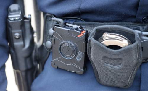 Steve Griffin  |  The Salt Lake Tribune

West Valley City Police officer Skyler Denning wears his new body camera, for the first time, on his sun glasses, in West Valley City, Monday, March 2, 2015. The cameras operating system and storage is located on the officer's belt or pocket. (pictured)