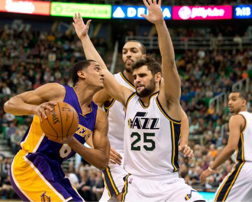 Lennie Mahler  |  The Salt Lake Tribune

Jordan Clarkson is guarded by Raul Neto and Rudy Gobert during a game between the Utah Jazz and the Los Angeles Lakers at Vivint Smart Home Arena in Salt Lake City, Saturday, Jan. 16, 2016.