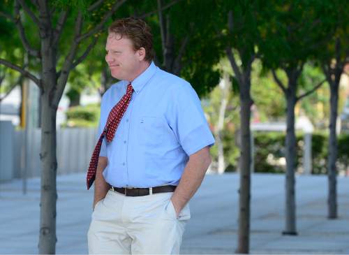 Scott Sommerdorf   |  The Salt Lake Tribune
Jeremy Johnson leaves the federal courhouse after a hearing in which he chose to be represented by attorneys Greg Skordas and Rebecca Skordas, Wednesday, July 22, 2015.