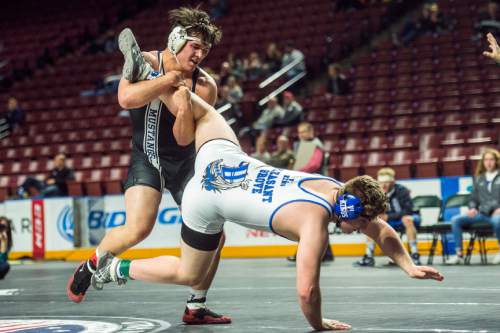 Chris Detrick  |  The Salt Lake Tribune
Pleasant Grove's Brandon Closson and Herriman's Wade French wrestle in the 220 pound during the 5A State Duals at the Maverik Center Thursday January 28, 2016.