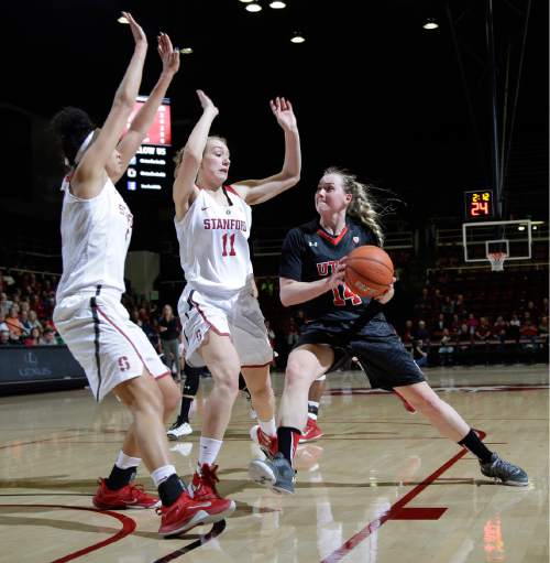 Utah guard Paige Crozon (14) is defended by Stanford forwards Alanna Smith (11) and Kaylee Johnson during the first half of an NCAA college basketball game Friday, Jan. 8, 2016, in Stanford, Calif.  (AP Photo/Marcio Jose Sanchez)