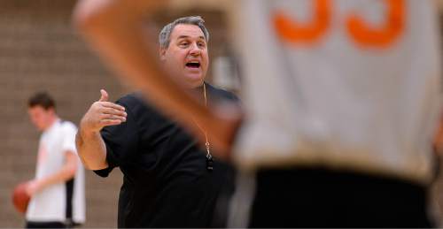 Trent Nelson  |  The Salt Lake Tribune
Ogden High School basketball coach Shawn MacQueen works out his team at practice in Ogden, Thursday January 28, 2016. Ogden's basketball program has registered two winnings seasons since 2001, with zero playoff wins. In the past two seasons before this year, the Tigers were collectively 6-39, including 0-22 in 2013. This season, they're competing for a region championship.