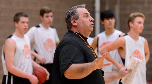 Trent Nelson  |  The Salt Lake Tribune
Ogden High School basketball coach Shawn MacQueen works out his team at practice in Ogden, Thursday January 28, 2016. Ogden's basketball program has registered two winnings seasons since 2001, with zero playoff wins. In the past two seasons before this year, the Tigers were collectively 6-39, including 0-22 in 2013. This season, they're competing for a region championship.