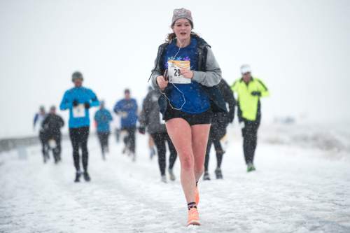 Chris Detrick  |  The Salt Lake Tribune
Runners brave a snowstorm while participating in the Salt Lake City Track Club's 5k at the Saltair in Magna on Saturday. It was the first race in the 3-race series, which will conclude with a 15k on Feb 27, 2016 at the Saltair.