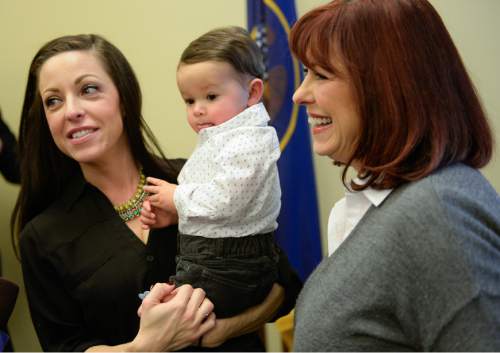 Francisco Kjolseth | The Salt Lake Tribune
Erin Finkbiner holds her son Max Puente, 1, as she discusses how the medication Naloxone, used to reverse the effects of narcotic drugs, helped her battle her heroin addiction. At right is her mother Jan Lovett. House Representatives presented a group of bills targeted at the opioid overdose crisis that is sweeping the state. Opioid overdose is on the rise in Utah. Utah ranks 4th highest in the nation for drug overdose deaths.
