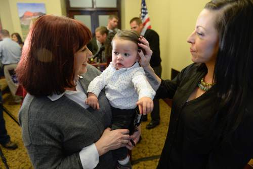Francisco Kjolseth | The Salt Lake Tribune
Jan Lovett, left, is smitten with her grandson Max Puente, 1, and is thankful for the medication Naloxone, used to reverse the effects of narcotic drugs, which helped her daughter Erin Finkbiner, right, battle her heroin addiction. House Representatives presented a group of bills targeted at the opioid overdose crisis that is sweeping the state. Opioid overdose is on the rise in Utah. Utah ranks 4th highest in the nation for drug overdose deaths.