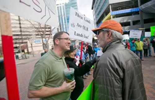 "Keep Public Lands Public" rally attendee Richard Prange (right) argues with and unidentified attendee (left, he refused to give his name) of a Western Rangelands Property Rights Workshop held at the Boise Centre in Boise, Idaho. Saturday January 30, 2016. Kyle Green for The Salt Lake Tribune