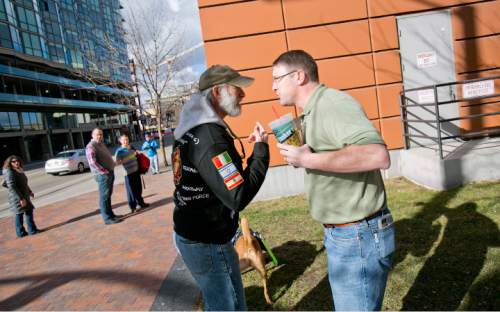 "Keep Public Lands Public" rally attendee Bryan DuFosse (left) argues with and unidentified attendee (right, he refused to give his name) of a Western Rangelands Property Rights Workshop held at the Boise Centre in Boise, Idaho. Saturday January 30, 2016. Kyle Green for The Salt Lake Tribune