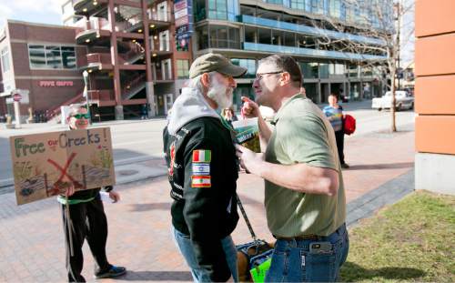 "Keep Public Lands Public" rally attendee Bryan DuFosse (left) argues with and unidentified attendee (right, he refused to give his name) of a Western Rangelands Property Rights Workshop held at the Boise Centre in Boise, Idaho. Saturday January 30, 2016. Kyle Green for The Salt Lake Tribune